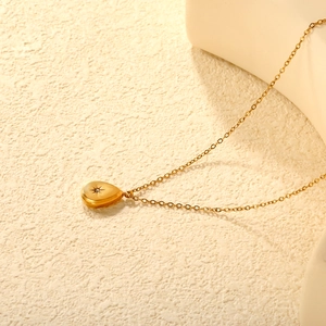 18K gold plated stainless steel teardrop necklace with starburst diamond pendant