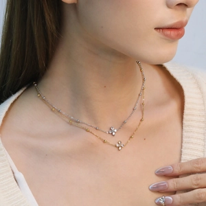 French style stainless steel petal pendant necklace with white zircon on a model