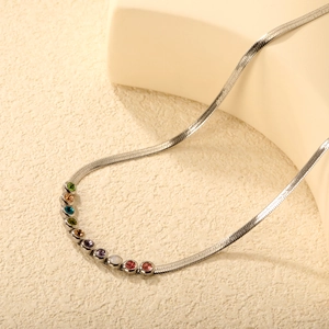 Silver herringbone blade chain necklace featuring vibrant multi-colored inlaid gemstones