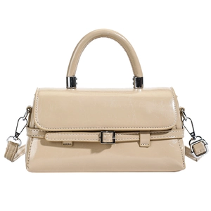 Elegant cream square crossbody bag with decorative belt strap and top handle for women