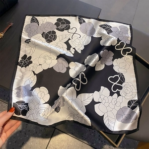 Elegant silk scarf with camellia and heart print in black and white satin finish