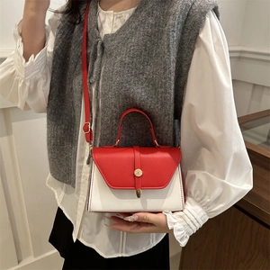 Minimalist square crossbody bag with red and white color blocking and gold hardware