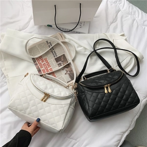 Elegant quilted PU leather crossbody bags in black and white with gold hardware