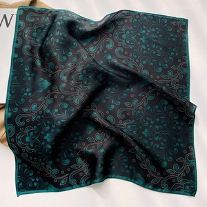 Luxurious green and black silk scarf with paisley patterns for elegant women styling