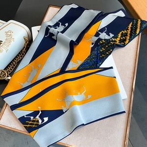 Fashionable long silk scarf with horse print and geometric blocks in orange and blue