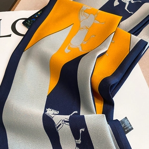 Detailed close-up of a long silk-feel scarf featuring a vintage horse print and smooth texture