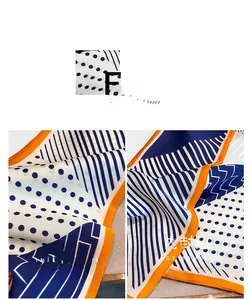 Dettaglio di sciarpa in finta seta con pois geometrici e rifinitura interna pulita