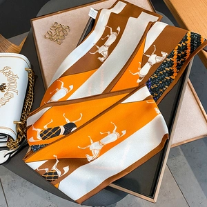 Elegant silk horse print skinny scarf in orange and brown tones for hair decoration