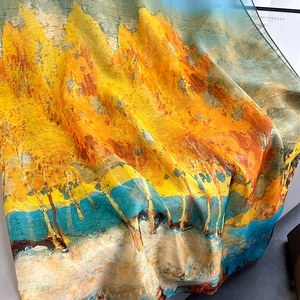 Close-up of translucent oil painting silk scarf with golden forest art and soft draping