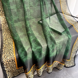 Emerald green and black gradient scarf with floral print and leopard pattern border