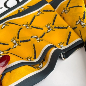 Detail of vintage horse print silk scarf showing twill texture and equestrian motif