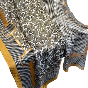 Houndstooth and paisley silk scarf shawl in mustard yellow and black patterns