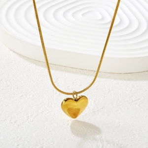 Elegant 18K gold heart pendant necklace featuring a polished snake chain for women
