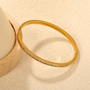 Bracelet moderne en acier inoxydable plaqué or 18 carats avec cristaux bleus