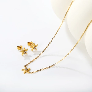 Elegant gold starfish jewelry set with sparkling crystals necklace and stud earrings