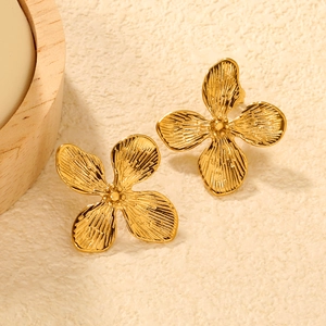 Boucles d'oreilles en acier doré avec œil de tigre et motif fleur étoile évidée