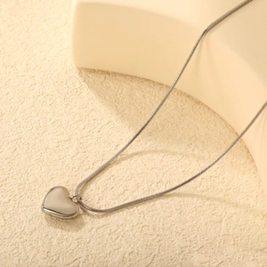 Polished silver heart pendant necklace on sleek snake chain with 18K mirror finish surface