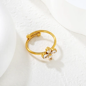 Detailed shot of an adjustable 18k gold plated ring with white zircon flower decoration