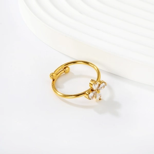 Detail of 18k gold adjustable ring featuring a crystal flower and marquise stones