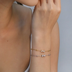Conjunto de collares con colgante de lazo y circonitas en acabados oro y plata