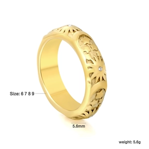 Gold celestial ring with sun, moon and star motifs featuring sparkling zircon accents