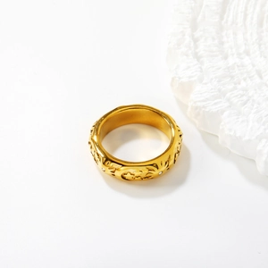 Gold wide band ring with celestial sun moon stars engraving and crystal accents