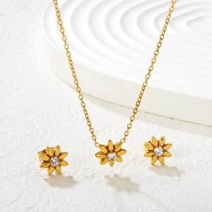 Minimalist 18k gold sunflower necklace and earrings set with sparkling crystal stones