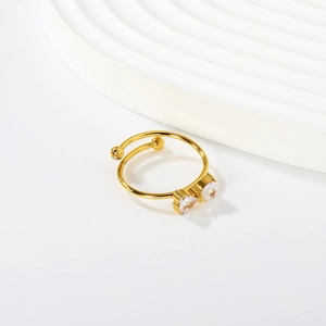 Elegant 18K gold-plated bow ring with pear-cut cubic zirconia in an adjustable open design