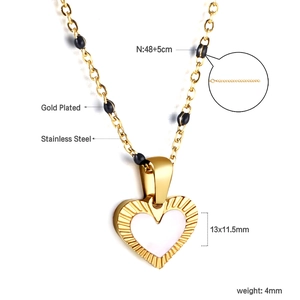 Detail view of heart pendant necklace with dimensions and stainless steel material specs