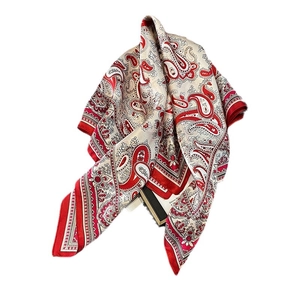 Elegant red and cream silk scarf with classic paisley pattern and dark red border trim