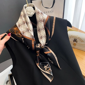Elegant vintage carriage print silk scarf with geometric patterns in black and beige