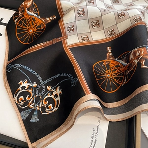 Detail of silk scarf with vintage carriage print and fine hand-rolled edges