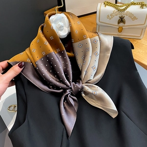 Polka dot silk scarf with yellow and coffee color blocking on a black sleeveless top