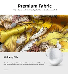 Detailed close-up of 100% mulberry silk fabric with gold floral patterns and silk cocoons