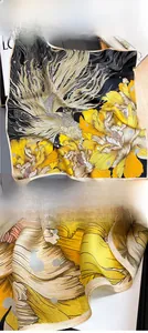 Detail view of premium silk scarf showing intricate botanical prints and precise hem edges
