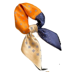 Silk neck scarf with chic polka dots and geometric patterns in orange and navy blue