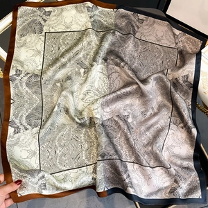 Elegant mulberry silk square scarf featuring artistic black and white pattern with contrast borders
