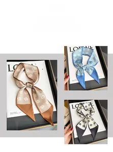Detailed view of geometric pattern silk scarves used as elegant hair bands and neckerchiefs