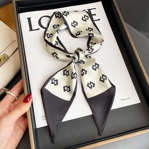 Elegant geometric chain pattern narrow silk scarf styled in a black luxury gift box