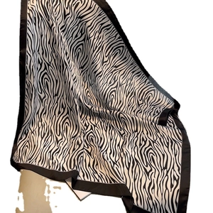 Zebra print silk scarf for women featuring black and white animal pattern and wide borders