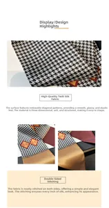 Close-up of houndstooth silk scarf featuring orange accents and twill fabric texture