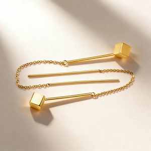 Minimalist long gold-plated stainless steel tassel earrings with polished cube pendants