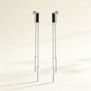 Minimalist long tassel earrings in stainless steel with black geometric shells and chain