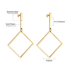 Macro view of gold-plated stainless steel geometric rhombus earrings with size specs