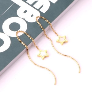 Gold-plated star drop earrings with white shell inlay and long S-shaped chain tassels