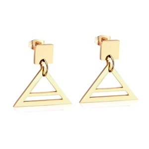 Detailed view of polished gold geometric earrings with triangle pendant and square stud