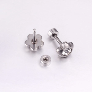 Detail of flower screw-back stud earrings with zircon inlay in polished stainless steel