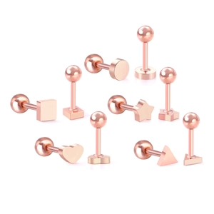 Detailansicht der roségoldenen Labret-Stecker mit Herz-, Stern- und Geometrie-Top