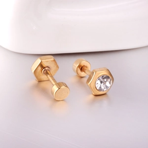 Detail view of gold hexagonal nut stud earrings with round clear zircon stones