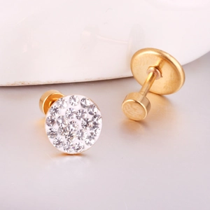 Macro shot of gold-plated stainless steel screw-back earrings with sparkling crystals
